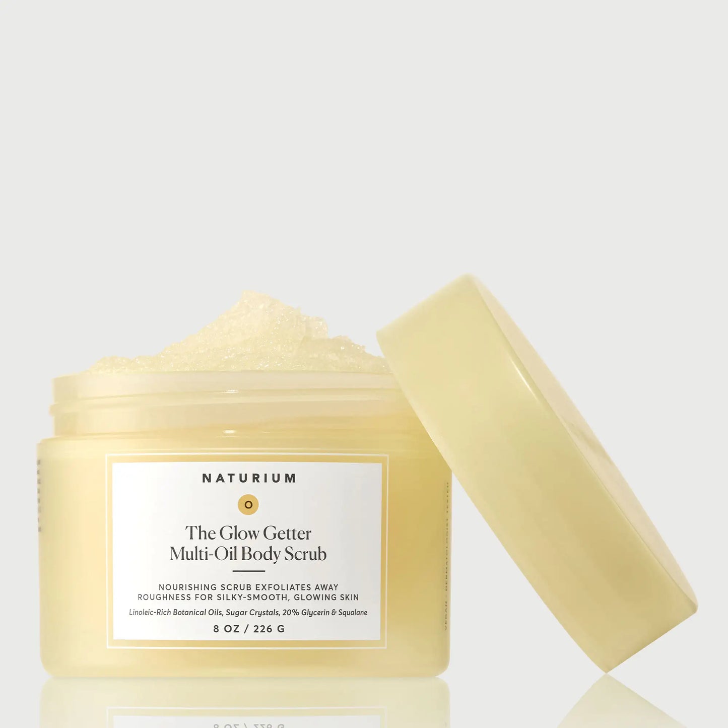 the-glow-getter-multi-oil-body-scrub-k6 NATR-40028-GlowGetter-Multi-Oil-Body-Scrub-Front-CapOff-bonebkgd.webp